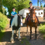 Young boy and mum on horses in County Antrim