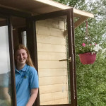 Young girl looking out window in County Antrim