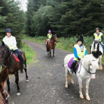 Happy riders on forest trail in County Antrim