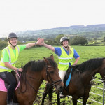 Riders high fiving on horses in County Antrim